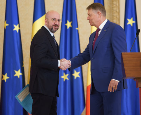 Bucharest, Romania. 27th Mar, 2023: Charles Michel (L), European Council President, shakes hands with Romanian President, Klaus Iohannis (R), ar the end of joint statements, at Cotroceni Palace.のeditorial素材