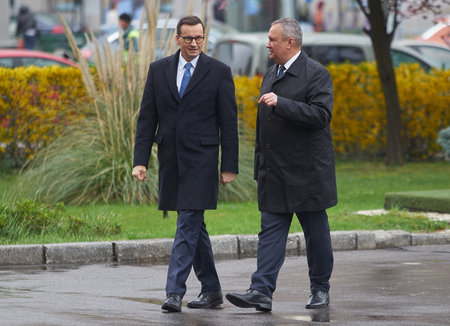 Bucharest, Romania. 28th Mar, 2023: The Polish Premier Mateus Morawiecki (L) is welcomed by Romanian Premier Nicolae Ciuca, during his official visit to Romania, at the Victoria Palace.のeditorial素材