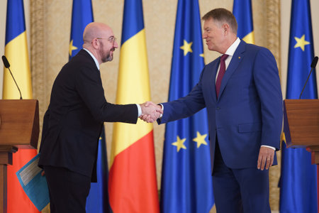 Bucharest, Romania. 27th Mar, 2023: Charles Michel (L), European Council President, shakes hands with Romanian President, Klaus Iohannis (R), ar the end of joint statements, at Cotroceni Palace.のeditorial素材