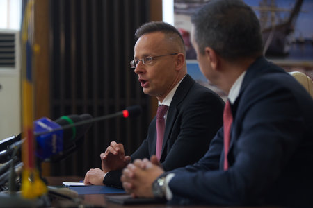 Bucharest, Romania. 4th Apr, 2023: Peter Szijjarto, left, The Minister of Foreign Affairs and Foreign Trade of Hungary, speaks, during the signing ceremony of the agreement between the Government of Romania, repesented by Sorin Grindeanu, the Romanian Minのeditorial素材