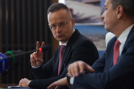 Bucharest, Romania. 4th Apr, 2023: Peter Szijjarto, left, The Minister of Foreign Affairs and Foreign Trade of Hungary, speaks, during the signing ceremony of the agreement between the Government of Romania, repesented by Sorin Grindeanu, the Romanian Minのeditorial素材