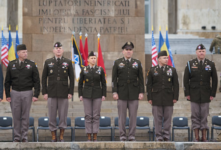 Bucharest, Romania. 5th Apr, 2023: Joseph McGee, (2-L), commanding major general of the 101st Airborne Division, and Gregory Anderson (C-R), commanding major general of the 10th Mountain Division, during the transfer of authority ceremony between the 101sのeditorial素材