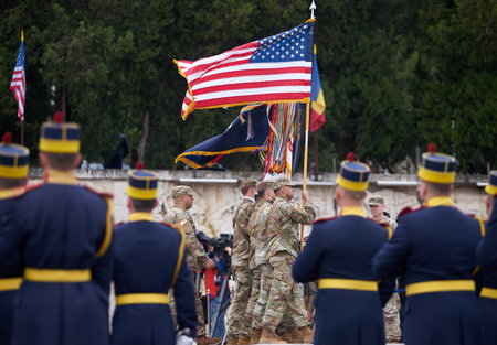 Bucharest, Romania. 5th Apr, 2023: American servicemen carries the battle flags of the units during the transfer of authority ceremony between the 101st Airborne Division (Air Assault) and the 10th Mountain Division, both of the US Army, at the Heroes of のeditorial素材
