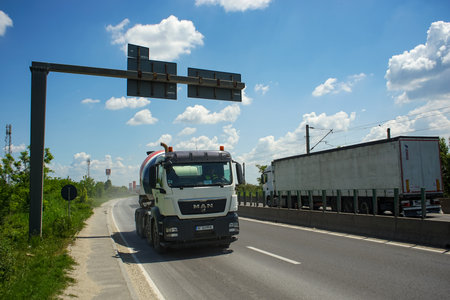 Tunari, Romania - Mai 24, 2023: Heavy trucks on traffic on the Bucharest ring road (DMCB) This image is for editorial use only.のeditorial素材