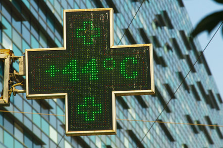 Bucharest, Romania - July 26, 2023: Extreme heat - 44 degrees celsius (111.2 fahrenheit) is the temperature displayed by a digital thermometer outside a pharmacy.のeditorial素材