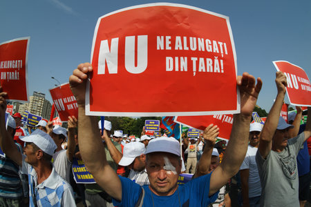 Bucharest, Romania - July 26, 2023: Up to 1,000 employees from the construction industry are protesting against government's intention to cut their fiscal facilities in front of Romanian Governmentのeditorial素材