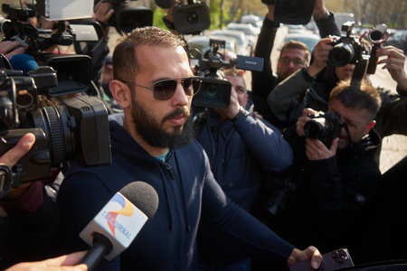 Bucharest, Romania. 10th Apr, 2023: Andrew Tate and his brother Tristan Tate (not in picture) leave the Directorate for Investigating Organized Crime and Terrorism DIICOTのeditorial素材