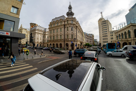 Bucharest, Romania - October 27, 2023: Wide view of the beautiful Victoriei Boulevard at the intersection with Grand Hotel Continental.のeditorial素材