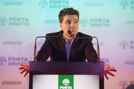 Bucharest, Romania - 2nd Mar, 2024: Nicusor Dan, the Mayor of Bucharest, speaks at the election conference of the Force of the Right party (FD).のeditorial素材