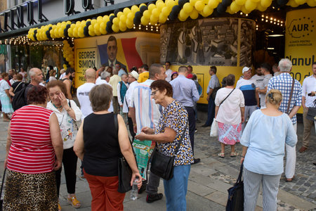 Bucharest, Romania. 22nd July, 2024: People wait to sign "The enrolment contract in the Simion plan", during a campaign action of George Simion, the presidential candidate of AUR party.のeditorial素材