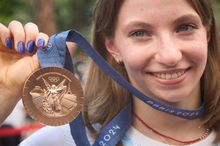 Bucharest, Romania. 16th Aug, 2024: Romanian gymnast Ana Maria Barbosu poses with her Olympic bronze medal won in the floor event, at the end of a ceremony, in Bucharest. Barbosu received the medal a few weeks after she was outranked by the American Jordaのeditorial素材