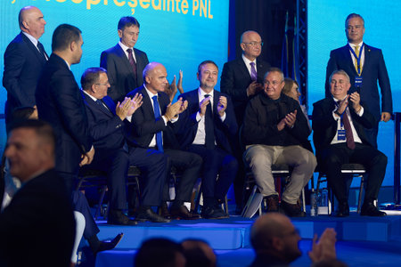 Bucharest, Romania. 15th Sep, 2024: Nicolae Ciuca (bottom row second right), PNL president, is applauded during the National Council of National Liberal Party (PNL), held at the Palace of the Romanian Parliament.のeditorial素材