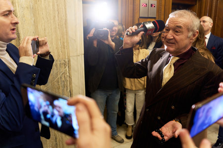 Bucharest, Romania. 20th Dec, 2024: George Becali (R), deputy for Alliance for the Union of Romanians (AUR), grabbed the microphone from a reporter in response to the questions he found objectionable.のeditorial素材