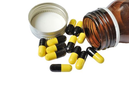 Spilled pills isolated on white backgroundの写真素材