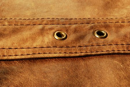 Brown leather with rivets (material, texture, decoration)の写真素材