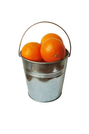 Bucket full of oranges isolated on white backgroundの写真素材