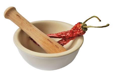 Red pepper in mortar isolated on white backgroundの写真素材