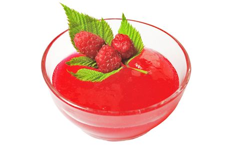 Raspberry jam in glass bowl isolated over white