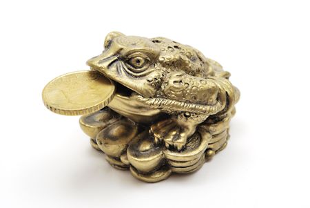 Netsuke Toad with coin on white backgroundの写真素材