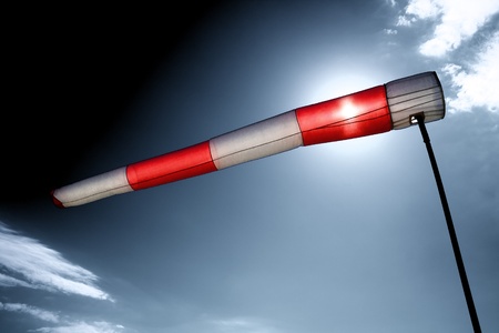 wind sleeve flying on a blue skyの写真素材