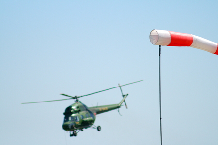 wind sleeve flying on a blue sky.の写真素材
