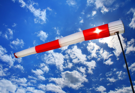 wind sleeve flying on a blue skyの写真素材