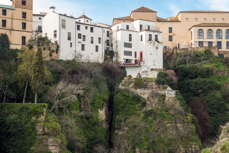 Residential buildings in the Spanish city of Ronda. Houses above the gorge of El Tajo. City over the abyss.のeditorial素材