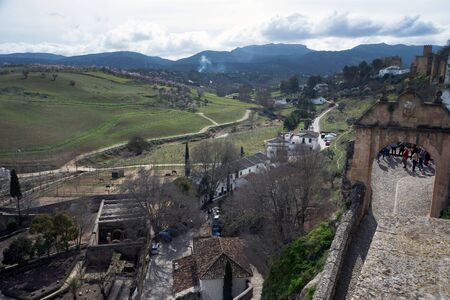 Ronda, Spain, February 2019. Beautiful city on top of a mountain in the Spanish province of Malaga in Andalusia. View of the valley. Tourists admire the scenery.のeditorial素材