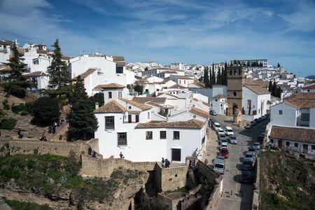 Ronda, Spain, February 2019. Beautiful city on top of a mountain in the Spanish province of Malaga in Andalusia. View of the valley. Tourists admire the scenery.のeditorial素材