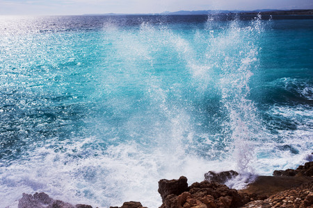Beautiful turquoise sea, the mountains in the haze and the embankment of the Promenade des Anglais...