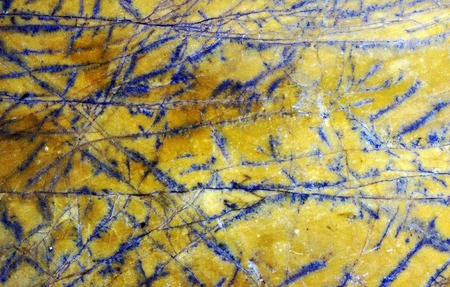 Bright old tile on a street in a spanish city. Texture.