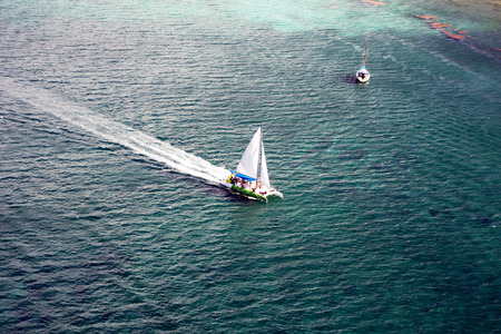 White pleasure boat in the Caribbean Sea, near the island of Saona, Dominican Republic. Top view...