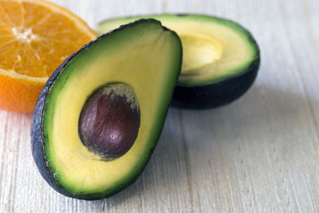 Avocado in cut. Exotic tasty and healthy fruit. Family Laurel. Proper nutrition. Close-up.