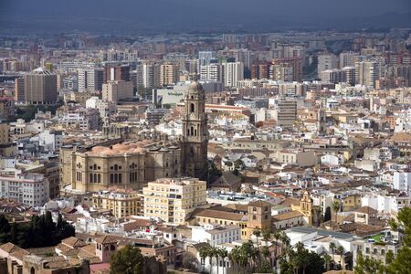 Malaga, Spain, February 2019. Panorama of the Spanish city of Malaga. Buildings  against a cloudy sky. Dramatic sky over the city. Beautiful view.のeditorial素材