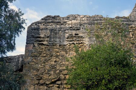 Malaga, Spain, February 2019.  The ancient stone walls of the Arab fortress Gibralfaro. Landmark of Malaga, Spain. Moorish fortress on a hill with a beautiful view.のeditorial素材