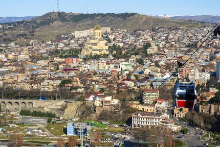 Tbilisi, Georgia, January 2018. Beautiful panoramic view from above on the capital of Georgia - the city of Tbilisi from the observation deck on a warm sunny day.のeditorial素材