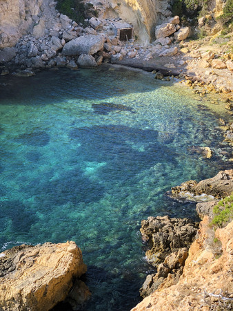 Seascape, view of the turquoise bay and stones. Rocky coast of Ibiza, Spain.のeditorial素材