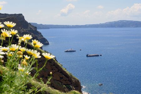 Sea, mountains and rocks. Greek island of Santorini on a warm sunny day. Travel to the picturesque...