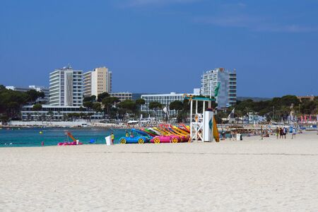 Palma Nova, Mallorca, July 2019. Wide sandy beach on the island of Mallorca in the early morning. Beautiful views of the sea, sky and hotels of the resort of Palma Nova. Relax. Balearic Islands.のeditorial素材