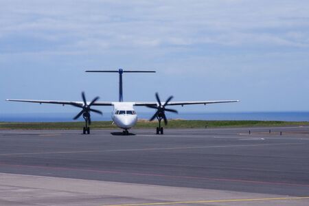 Ponta Delgada, Portugal, June 2019. The plane SATA Air Acores landed at the airport of Ponta Delgada, the island of San Miguel, Azores. Warm sunny day at the airport. Travel to the Azores.のeditorial素材