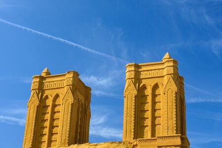Sand castle on the shore of the North Sea against the blue sky. Sand sculptures on the Ostend...