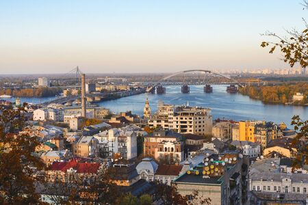 Golden autumn in Ukraine. View of the Dnieper, houses, bridges of the capital of Ukraine, Kiev.