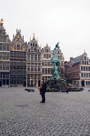 Antwerp, Belgium, November 2019. Flemish Renaissance style trading guild houses and the Brabo fountain in Markt Grotto. Antwerp on a gray autumn day.のeditorial素材
