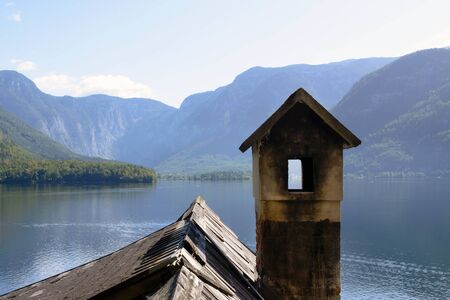 Traditional old austrian wooden house in Hallstatt, Austria. The roof of the house on the background of the Austrian mountains. Travelの写真素材