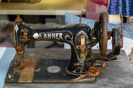 Hallstatt, Austria, September 2019. Old rusty Anker sewing machine in a traditional clothing store.のeditorial素材