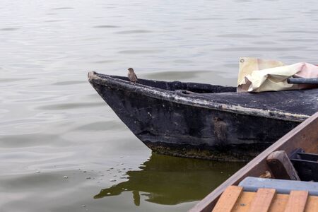 Valencia, Spain. Old black pleasure boat. Lake and Albufera Natural Park (El Parque Natural de la...