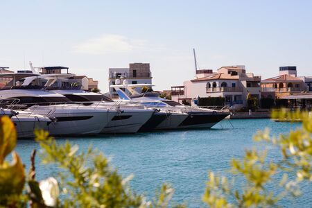 Luxury white yachts against the blue sky in the harbor of the port of Limassol Marina, Cyprus.の写真素材