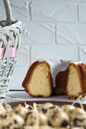 Delicious sweet cottage cheese Easter cupcake on a background Easter basket on a pink background....
