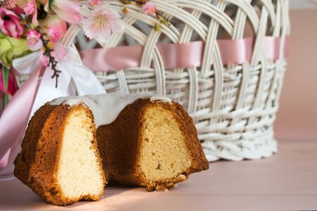 Delicious sweet cottage cheese Easter cupcake on a background Easter basket on a pink background....