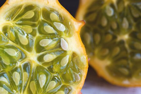 Exotic vegetable cucumis metuliferus, African cucumber closeup, soft focus. Vegetarian food. Texture.の写真素材